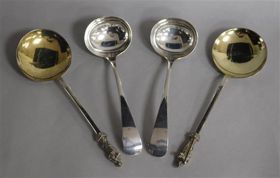 A pair of Victorian silver apostle serving spoons and a pair of George V silver Old English pattern sauce ladles, 11 oz.